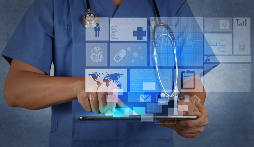 Project management SharePoint A medical practitioner using a tablet device with holograms appearing from the screen to represent SharePoint Project Management