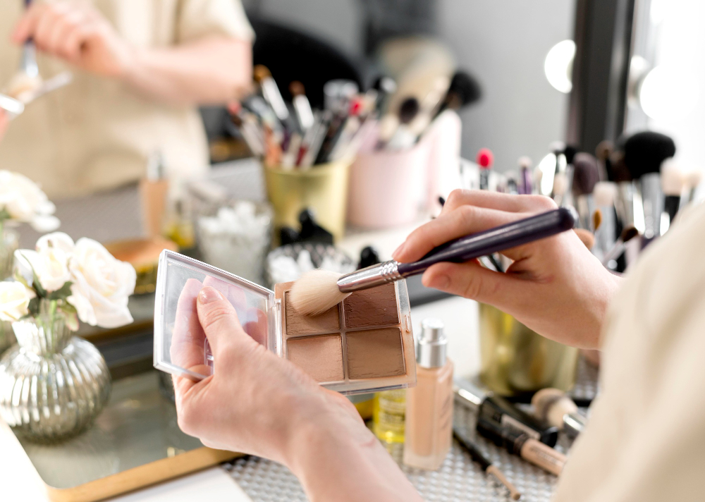 Make-up and beauty items in front of a mirror to represent FMCG SharePoint migration